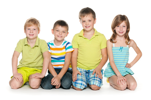 Sitting four cheerful children - Foto, Bild