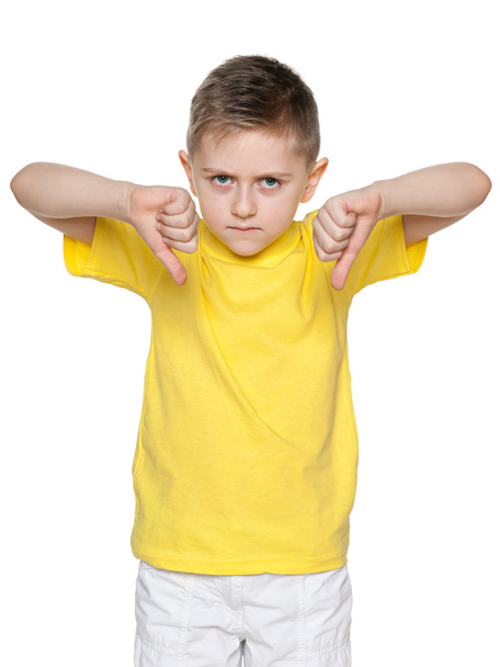 Young boy holds his thumbs down - Zdjęcie, obraz