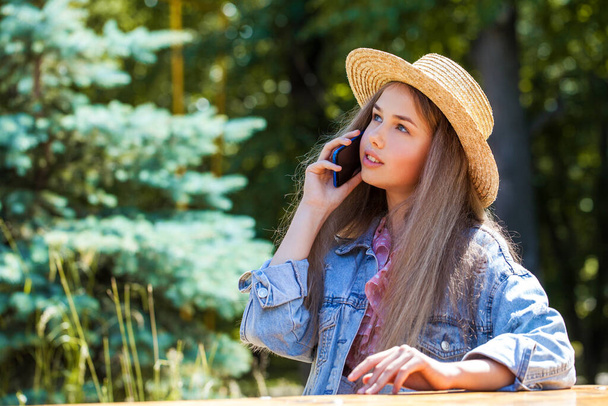 Young teenager girl with a mobile phone - Photo, image