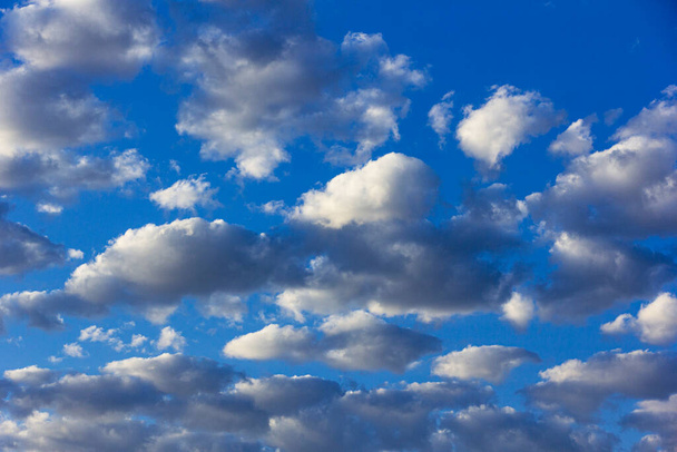 Blue sky with white and gray clouds. - Valokuva, kuva