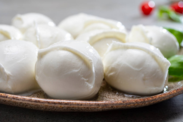 Tasty italian food, fresh white buffalo mozzarella soft cheese balls from Campania close up - Photo, Image