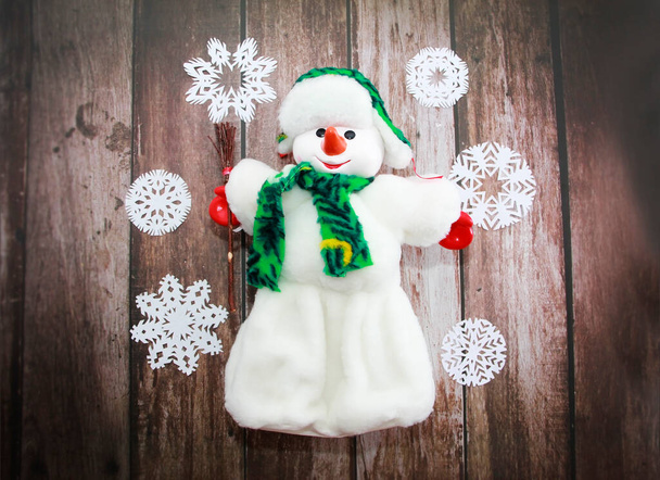 Christmas toy snowman in white fur coat and hat - Photo, Image