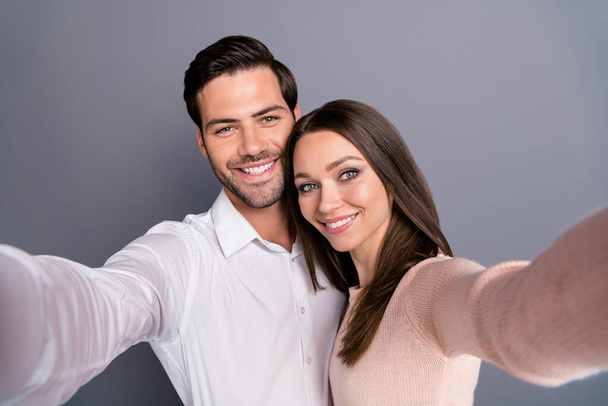 Closeup photo beautiful lady handsome guy couple good mood spend quarantine stay home together take selfies smiling cheery toothy wear shirt pullover isolated grey color background - Fotografie, Obrázek