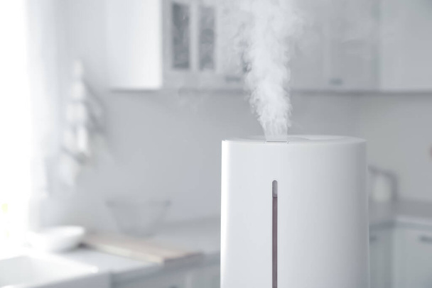 Modern air humidifier in kitchen, closeup. Space for text - Фото, зображення