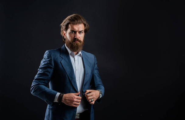 stylish mature man looking modern. mens office wardrobe. fashionable man dressed in suit. formal fashion model. handsome man on gray background. serious bearded businessman. copy space - Foto, afbeelding