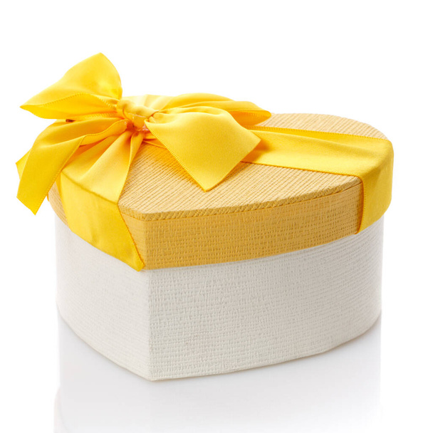 Heart shaped Valentine's Day gift box on white background. Surprise for the holidays. - 写真・画像
