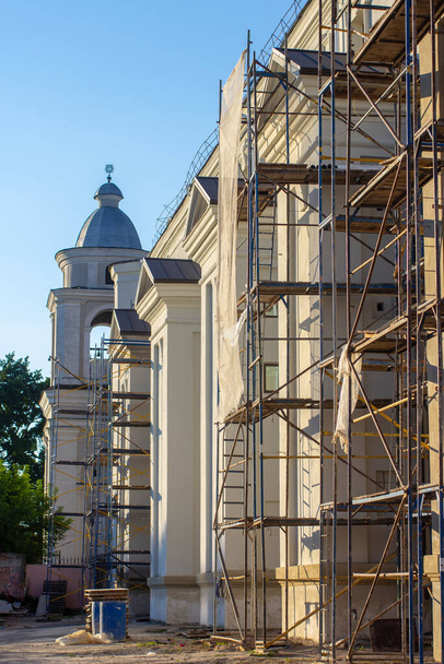 Scaffolding near a baroque monastery. Restoration of an architectural monument. - Photo, Image