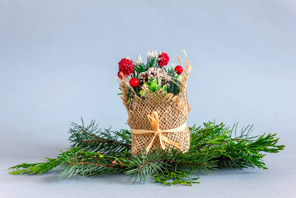 Christmas decoration, green thuja branches on blue background - Fotografie, Obrázek