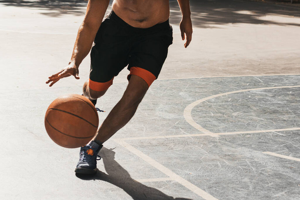 unrecognizable young man playing basketball - Fotó, kép