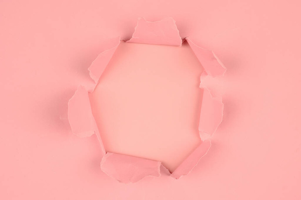 Pink tear paper, on pink. High quality photo - Foto, imagen