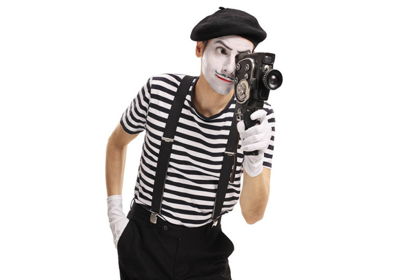 Mime recording with a vintage camera isolated on white background - Foto, Imagen