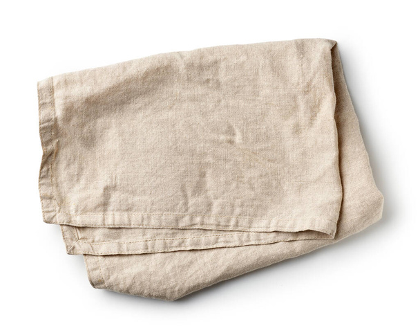 gevouwen linnen servet geïsoleerd op witte achtergrond, bovenaanzicht - Foto, afbeelding