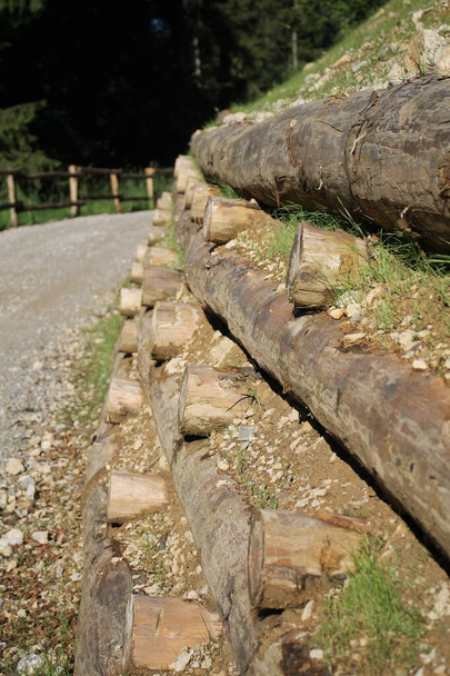 wooden log crib wall on alpine road, palificata viva ingegneria naturalistica - Photo, Image