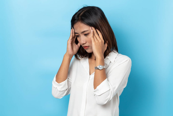 young woman having headache on white background - Φωτογραφία, εικόνα