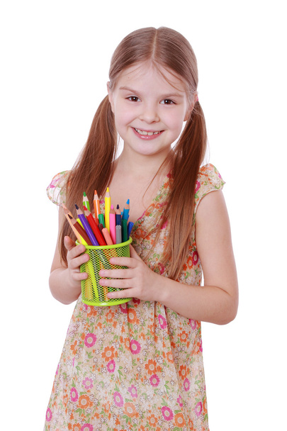 Girl with colored pencils in hands - Foto, afbeelding