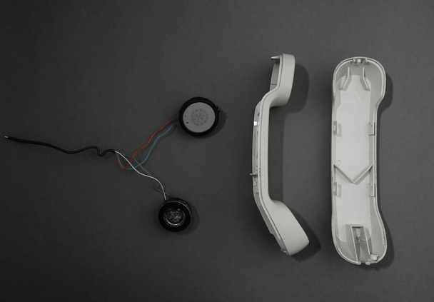 disassembled handset and speaker inside. listening device inside. isolated - Valokuva, kuva