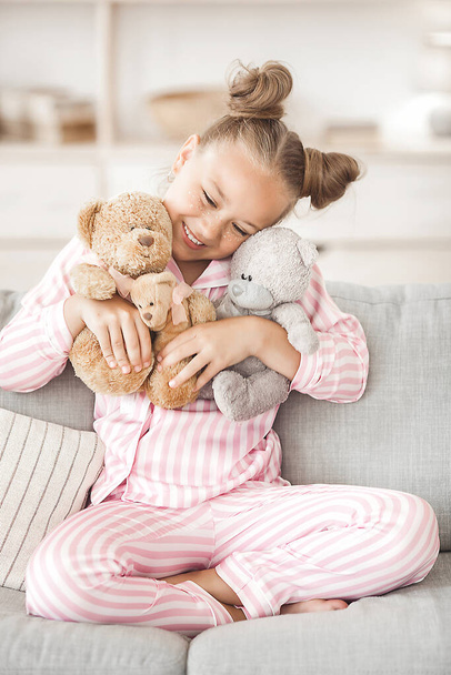 Cute little girl in pajamas indoors - Foto, Imagen