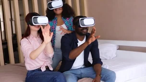 African-American girl Vanessa, her mom and dad in VR glasses. International family in VR glasses. - Кадры, видео