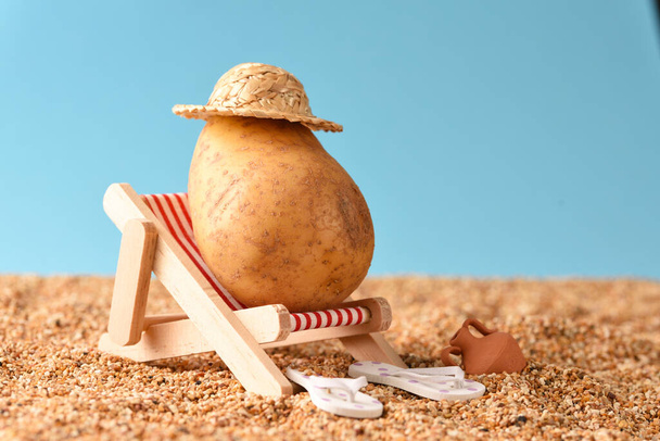 Potato  on the sunbed, conceptual photo vacation in the sun. - Photo, Image