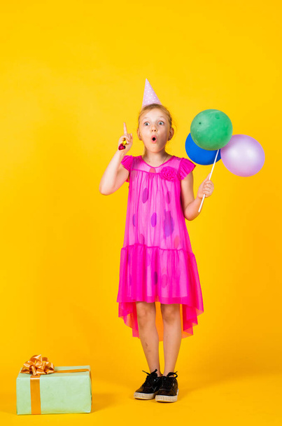 celebration. kid fashion beauty. imagination and inspiration. birthday party present. small girl with balloon. prepare for holiday. ready to celebrate. concept of dreaming. childhood happiness - Photo, Image