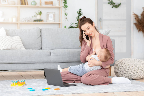 Freelance And Maternity. Woman Breastfeesing Baby, Talking On Cellphone And Using Laptop - Φωτογραφία, εικόνα