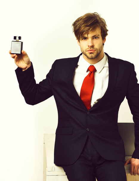 Caucasian stylish business man posing with perfume - Zdjęcie, obraz
