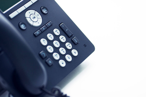 Deskphone, office and business concept. New ip phone with buttons and big display for communication without interference. Top view. Space for a text. Close up. - Foto, Bild