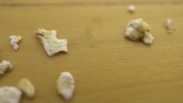 Hercules flakes on a wooden surface. Moving platform with oatmeal macro shot. - Video, Çekim