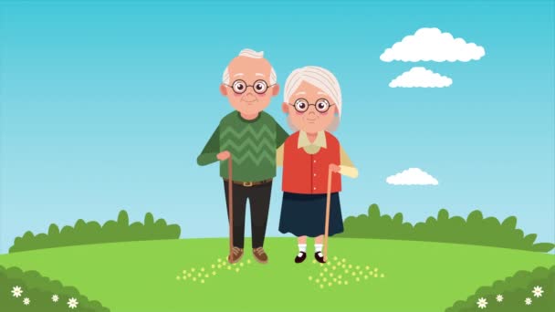 felice carta di giorno nonni con vecchi amanti coppia nel campo - Filmati, video