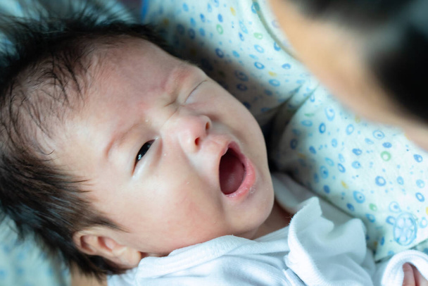 Abstract blur image of Asian Chinese New born child tired and hungry - Фото, изображение