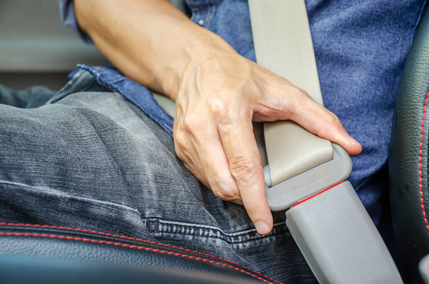 Lack a seat belt before driving a car, Closeup of man fastening seat belt in car, Safety belt safety first. - Fotoğraf, Görsel