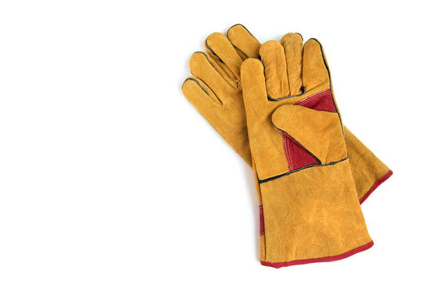 Yellow protective gloves isolated on white background. - Photo, Image