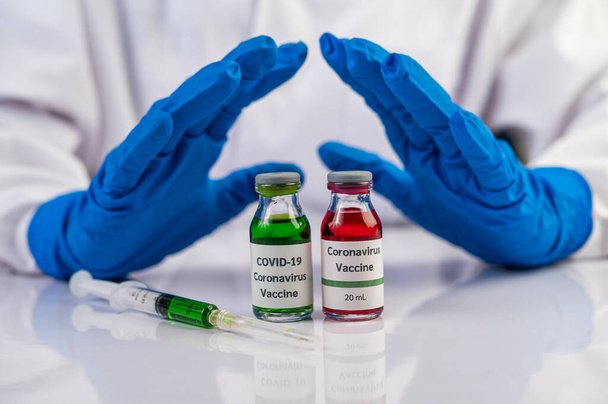 Вчені носять блакитні рукавички і роблять руки неприйнятною вакциною Вибірковий фокус
 - Фото, зображення