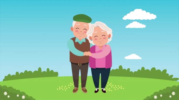 felice carta di giorno nonni con vecchi amanti coppia nel campo - Filmati, video