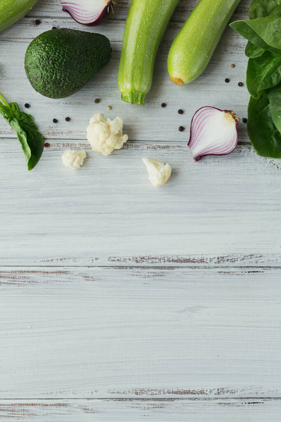 Healthy food on white wooden table mock up. Delicious, organic, tasty and ripe vegetable background with copy space for text. - Foto, imagen
