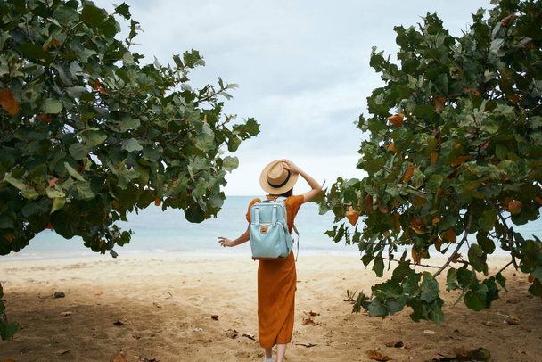 Woman tourist backpack travel island beach tropics  - Photo, Image