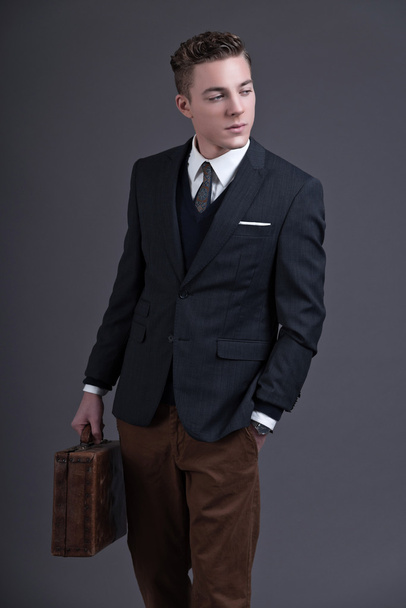 Retro fifties fashion young businessman wearing dark suit and ti - Zdjęcie, obraz