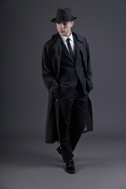 Retro fashion fifties young businessman with hat wearing dark su - Foto, imagen