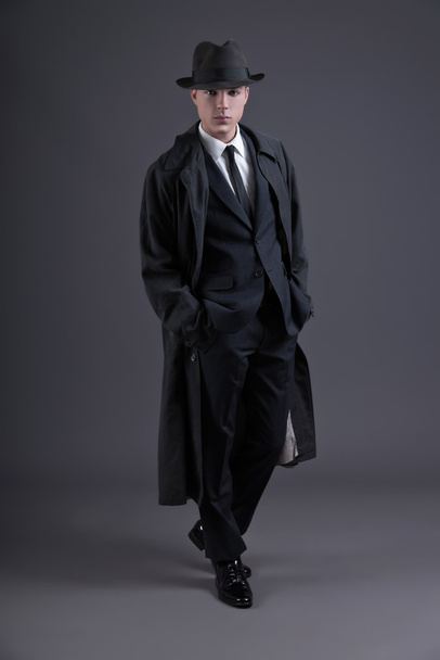 Retro fashion fifties young businessman with hat wearing dark su - Zdjęcie, obraz