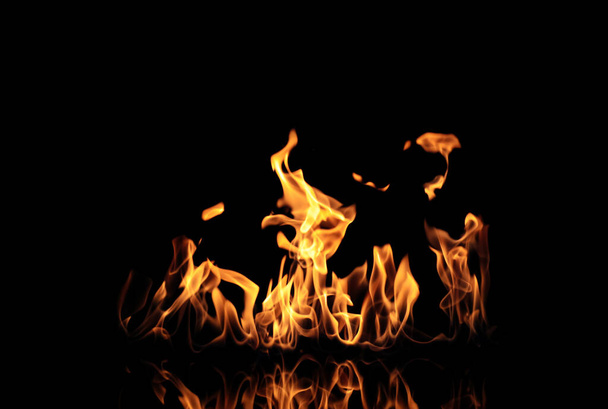 Beautiful bright fire flames on black background - Fotoğraf, Görsel