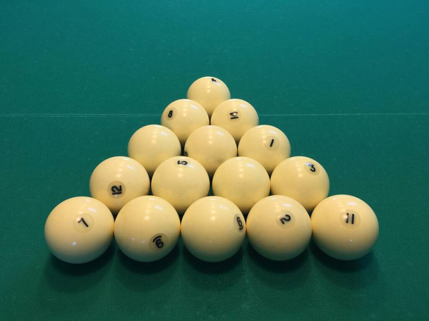 A pyramid of billiard balls on a green cloth.  - Photo, Image