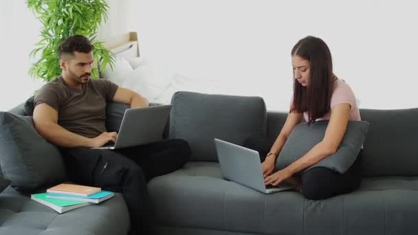 The couple working at home, Social distancing while using computer to work from home. family relationship and couple together concept. Couple lovers stay home and keep social distance with new normal. - Footage, Video