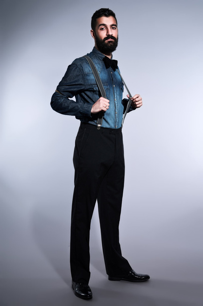 Retro hipster 1900 fashion man with black hair and beard. Wearin - Zdjęcie, obraz