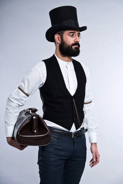 Retro hipster 1900 fashion man with black hair and beard. Wearin - Photo, Image
