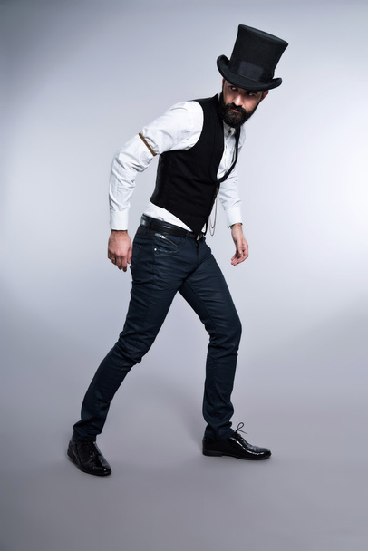 Retro hipster 1900 fashion man with black hair and beard. Wearin - Photo, Image