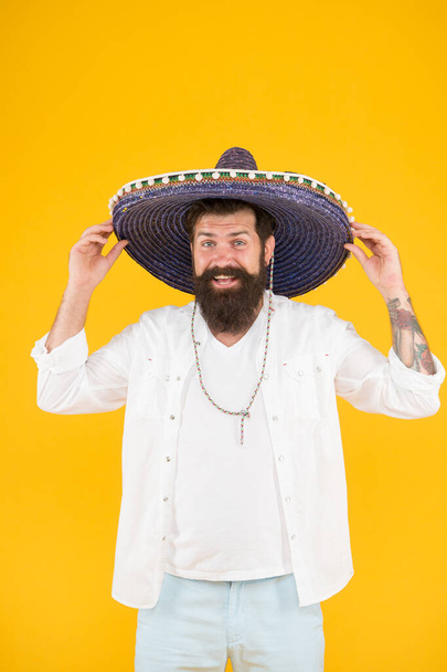 Ancestry language and cultural traditions. Discover ethnic and geographic origins. Bearded man in mexican hat. Mexican man wearing sombrero. Guy in wide brim hat. Ethnic concept. Ethnic background - Foto, immagini