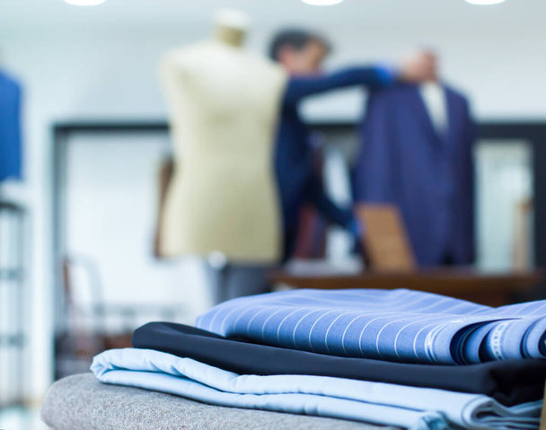 Mannequins in a tailor shop and tailored suits. Concept of: tailoring, businessman, elegance. - Valokuva, kuva