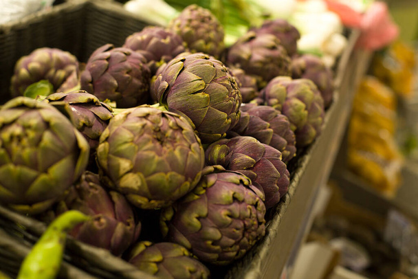 Artichoke in the market. Concept of healthy food, bio, vegetarian, diet. - Фото, изображение