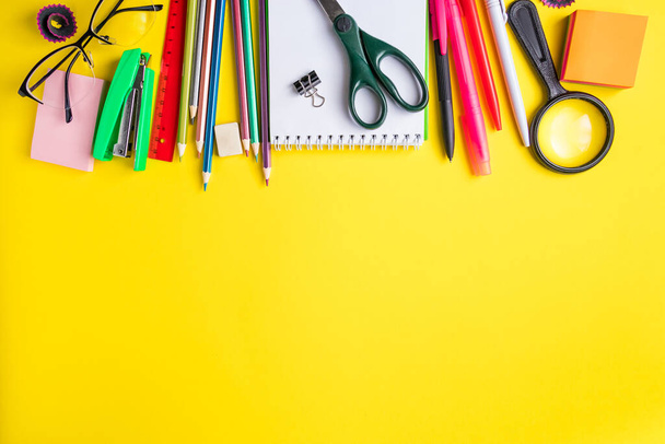 Set of school supplies on a yellow background. Place for text. - Photo, Image