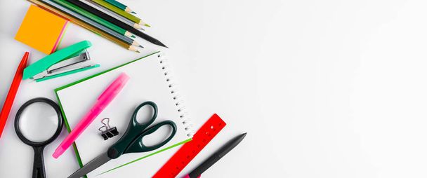 A set of office supplies on a white background. Back to school concept. Place for text. Banner format - 写真・画像